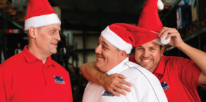 IBCI Team in Warehouse for Christmas Shoot - We Win WIth Our People - IBCI Power Blog